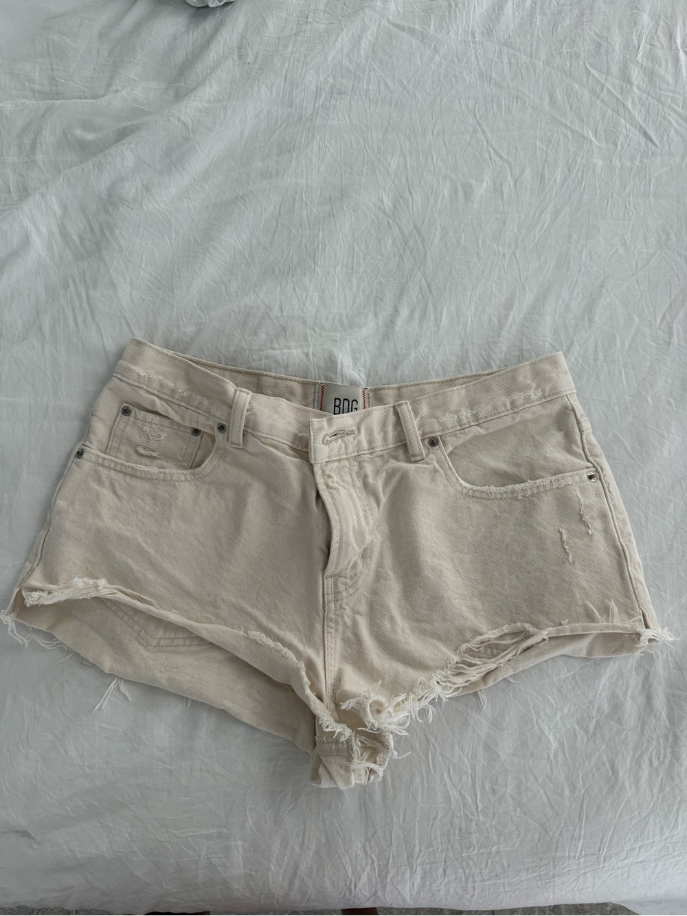BDG Cream Distressed Cutoff Denim Shorts